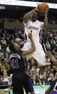 Wake Forest's Al-Farouq Aminu (1) shoots over High Point's David Singleton (11). (AP)
