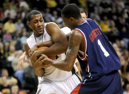 Wake Forest's David Weaver, left, and Richmond's Darrius Garrett struggle for possession of the ball during an NCAA college basketball game at the LJVM Coliseum in Winston-Salem, N.C., Thursday, Dec. 31, 2009. (AP Photo/Winston-Salem Journal, Lauren Carroll)