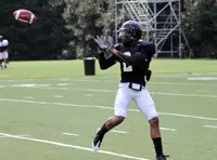 Chris Givens hauls in a pass on Monday.