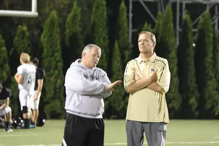 Athletic Director Ron Wellman and head coach Jim Grobe watch practice.