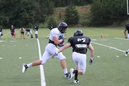 John Stamper (right) gets ready to make a hit on tight end Andrew Parker.