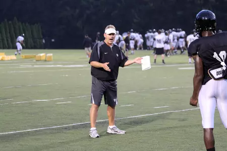 Assistant coach Brian Knorr gives instruction to the wide receivers.