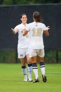 Katie Stengel and Rachel Nuzzolese celebrate one of Wake's four goals against Clemson