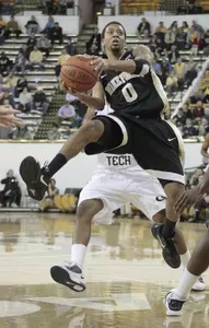 Wake Forest guard J.T. Terrell (0) looks to pass as he drives during the first half.