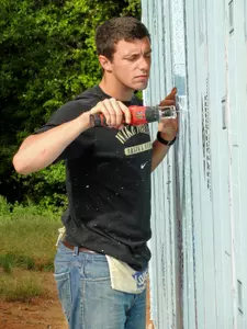 Alex Hill participating in the Habitat for Humanity construction project