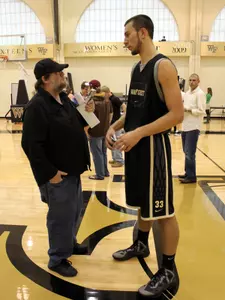 Winston-Salem Journal reporter Dan Collins talks with sophomore center Carson Desrosiers.