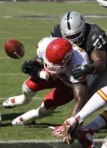 Linebacker Aaron Curry makes a hit on Kansas City's LeRon McClain during last week's game.