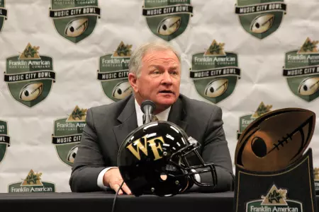 Coach Grobe talking with members of the media.