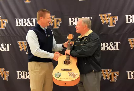 Music City Bowl CEO Scott Ramsey presented Jim Grobe with a commemorative guitar before today's press conference.