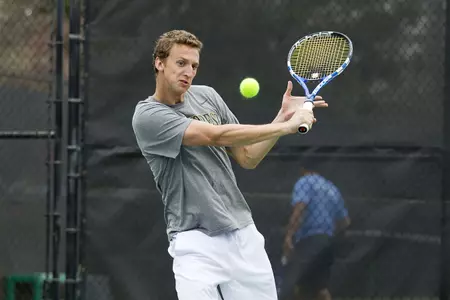 Iain Atkinson earned a tough three-set win at No. 3 singles