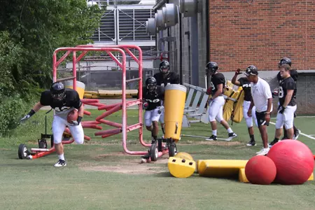 Tommy Bohanon fights his way through a drill.