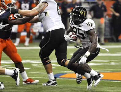 Josh Harris looks for running room against Syracuse.