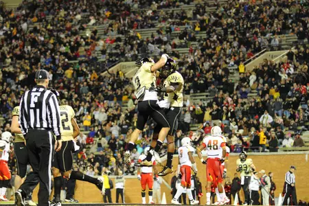 Terence Davis and Michael Campanaro celebrate a touchdown last year against Maryland