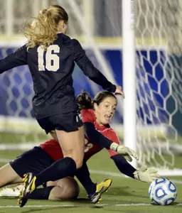 Katie Dry tries to score against Maryland