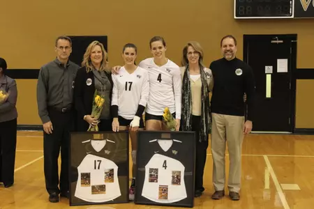 Heather Kraft (left) and Andrea Beck played in their final match on Senior Night