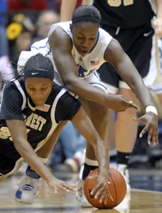 Wake Forest's Secily Ray battles for a loose ball during the first half with Duke's Chelsea Gray.