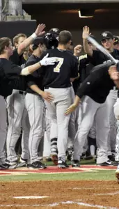 The Deacs celebrate Mac Williamson's fourth inning solo homer.