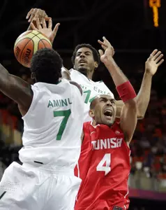 Brother's Al-Farouq (front) and Alade Aminu helped Nigeria to a win in its Olympic basketball debut. (AP Photo/Eric Gay)