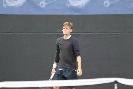 David Goffin fought through three sets and two rain delays to defeat Lukasz Kubot.