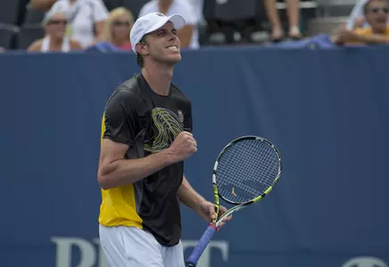 Sam Querrey celebrates after defeating Jarkko Nieminen in a marathon third set tiebreaker.