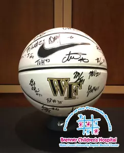 The basketballs are hand-signed by the 2014-15 men's basketball team and coaching staff.