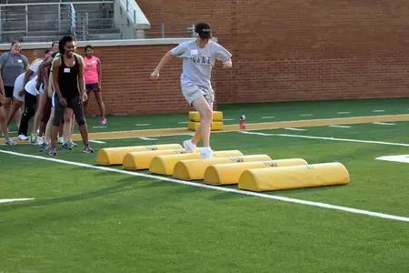 Participants will be put through football drills on the turf at BB&T Field.