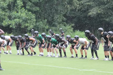 The team worked out in helmets and shorts on Friday