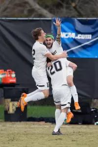 Ricky Greensfelder (wearing green headband) with Hunter Bandy (20) and Brad Dunwell