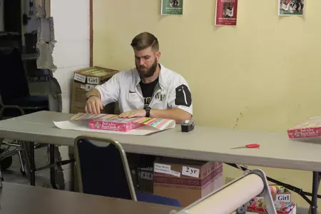 Ryan Horn wraps a gift