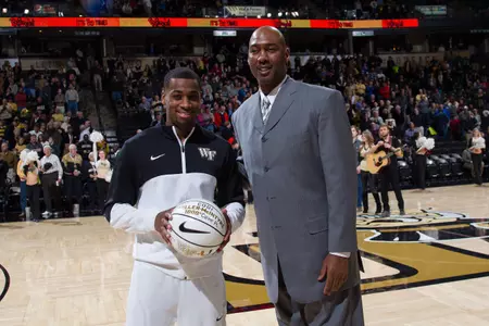 Codi Miller-McIntyre (L) and head coach Danny Manning (R)