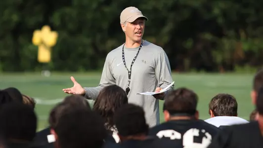 Head coach Dave Clawson speaking to the team after practice