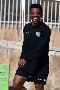 Jacori Hayes laughing during soccer volleyball.