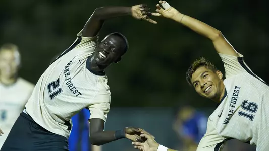 Machop Chol and Omir Fernandez celebrate a goal