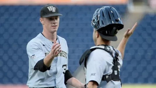 Wake Forest Bobby Seymour (3) is congratulated on their win during game two of the 2019 ACC Baseball Tournament in Durham, N.C., Tuesday, May 21, 2019. (Photo by Sara D. Davis, the ACC)