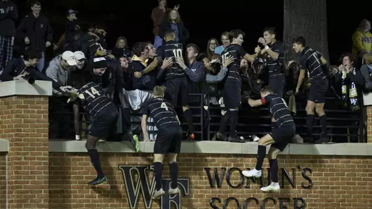 Wake Forest jumps on Walt's Wall after a win