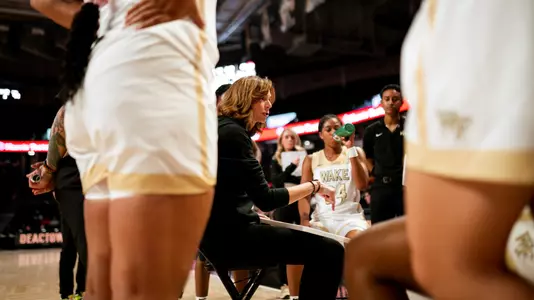 Megan Gebbia and women's basketball team