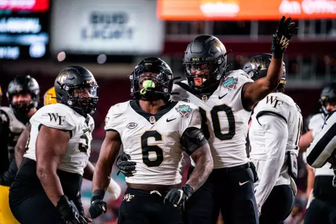 Justice Ellison and Jahmal Banks celebrating after a touchdown