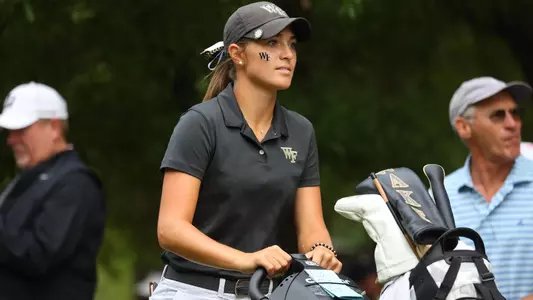 rachel kuehn walking with golf bag