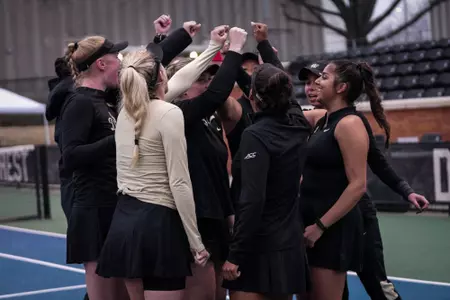 Women's Tennis huddle