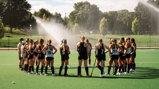 field hockey team huddle