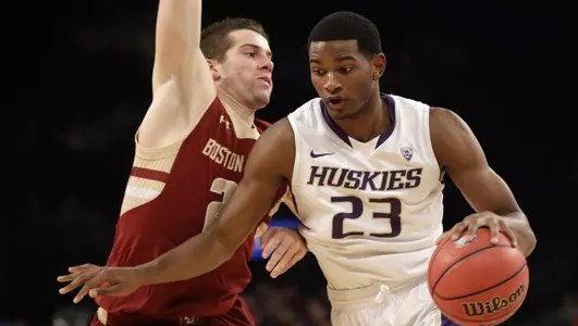Washington's C.J. Wilcox, right, drives