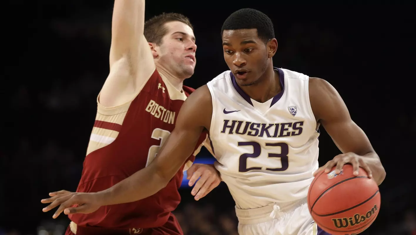 Washington's C.J. Wilcox, right, drives