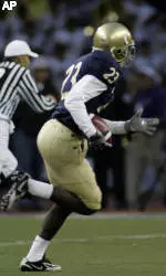 Huskies Edged By Trojans, 27-24