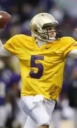 Smiling As Usual, Price Goes About Business Next To Montana