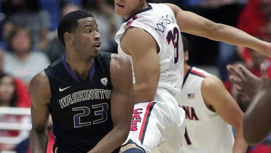 Washington's C.J. Wilcox (23) looks to