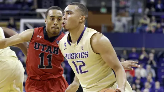 Washington's Andrew Andrews (12) drives