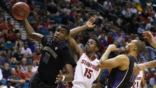 Washington's Mike Anderson, left, grabs