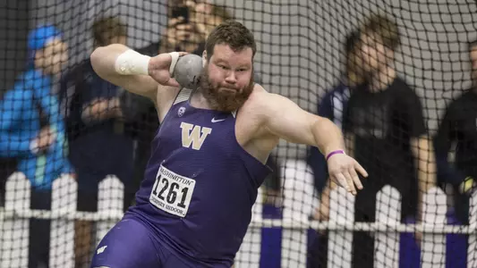 Jack Lembcke lets one fly in the shot put at the UW Invitational