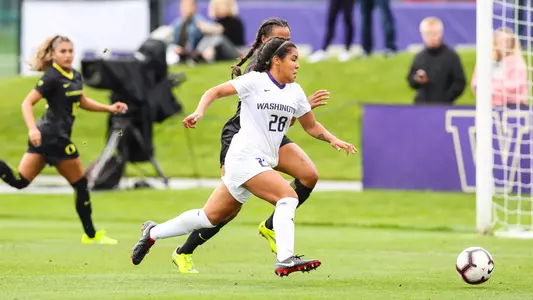 Makena Carr dribbles past a defender
