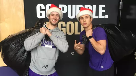 Chris Micheles and Michael Petrie clothing drive photo.